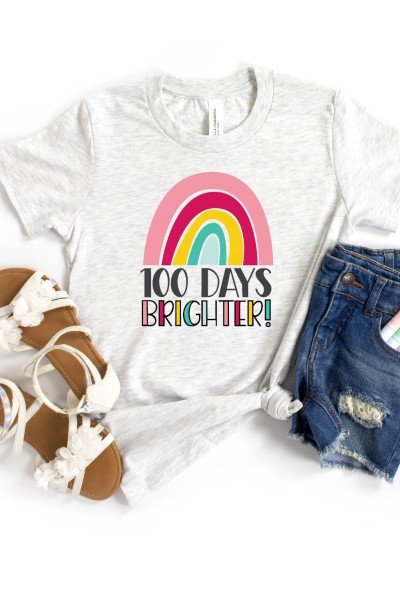 Blue jean shorts with markers in the pocket, white sandals and a t-shirt with a rainbow on it and the saying 100 Days Brighter