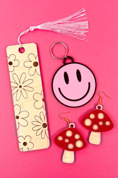 All three laser projects on pink background