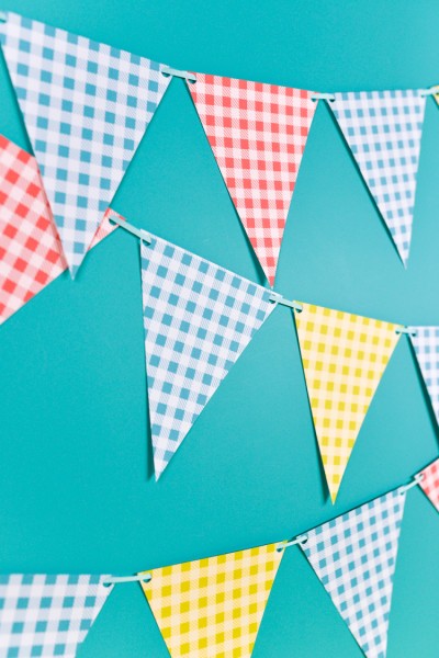 Image of buffalo plaid pennants in blue, yellow, red and white
