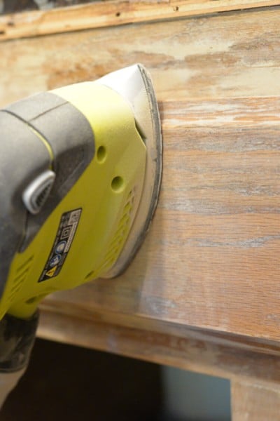 A piece of wood and a sander
