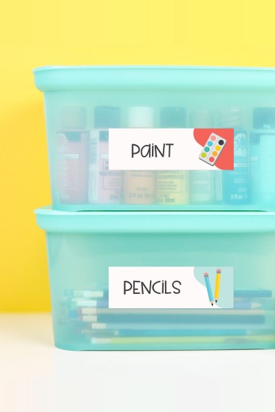School supplies in boxes with classroom labels.