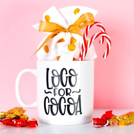 Final Loco for Cocoa mug with candy and candy canes.