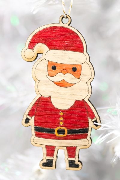 colored santa ornament on white tree