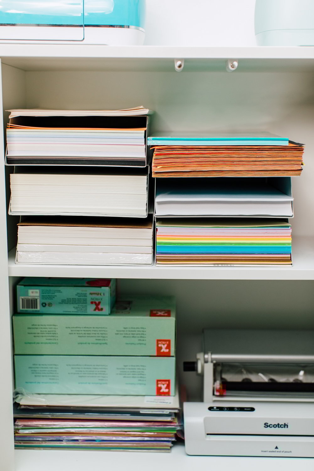 Eket cabinet with stacks of paper and Xyron