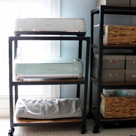 A cart holding three Cricut machines