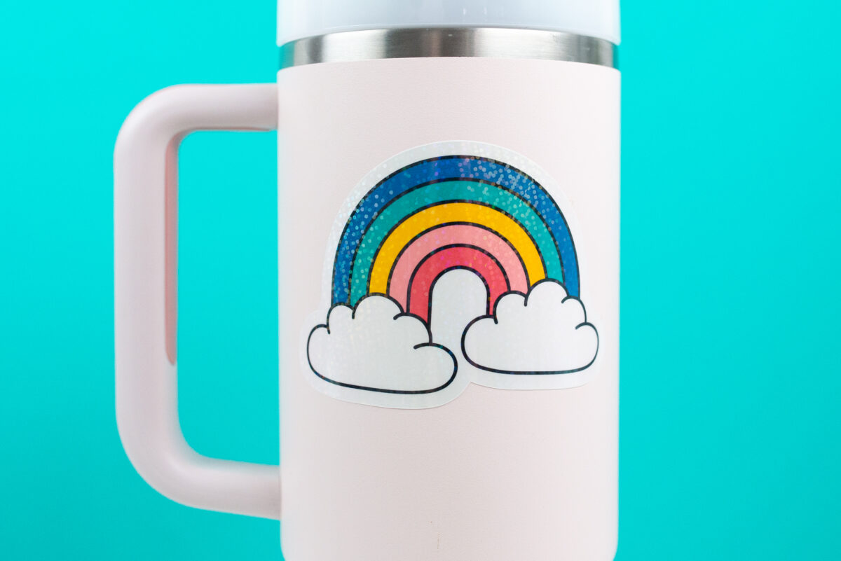 Stanley tumbler with rainbow sticker closeup
