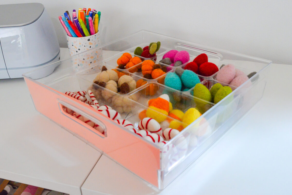 Drawer on table top showing organizing system within drawer.