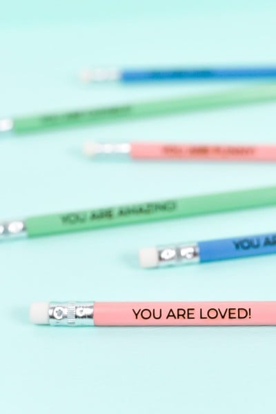 Engraved Pencils on Blue Background
