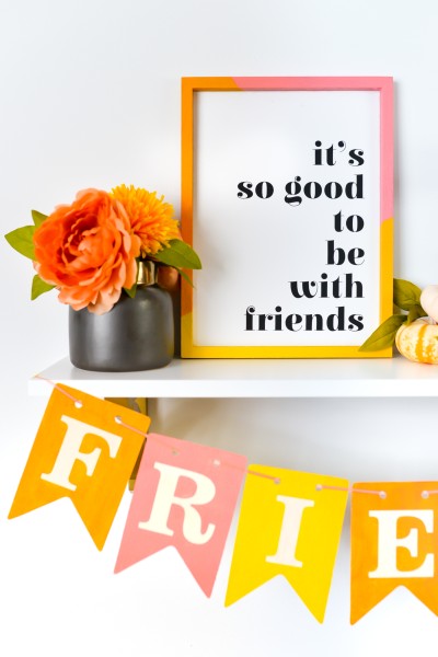 Closeup of "it's so good to be with friends" sign