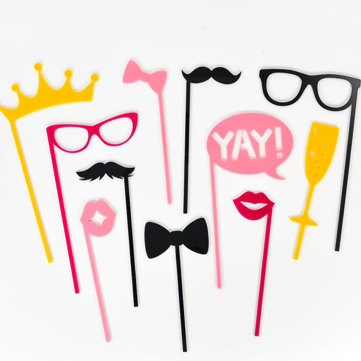 Yellow, pink and black booth props made with a glowforge.