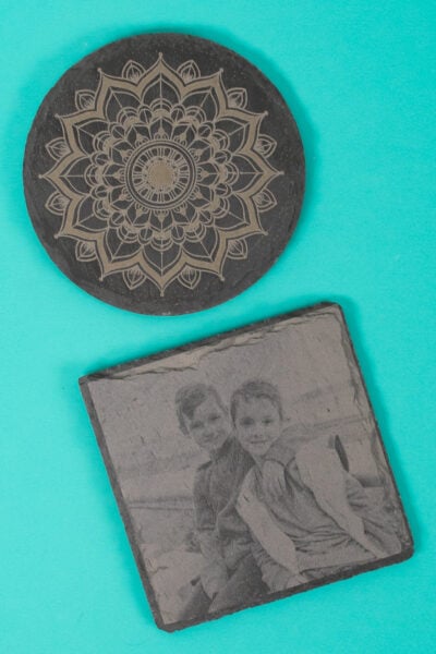 Final engraved slate projects with teal background