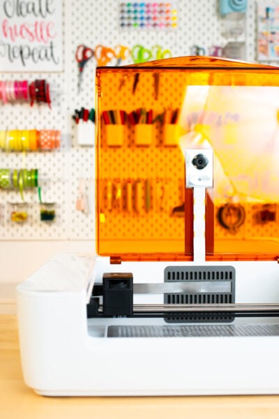 Open Glowforge Spark on craft table with craft supplies in the background