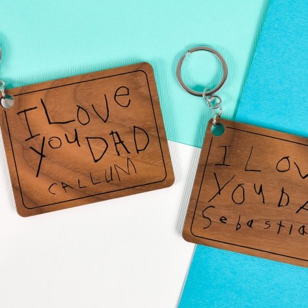 Finished keychains with child's handwriting made on a Glowforge