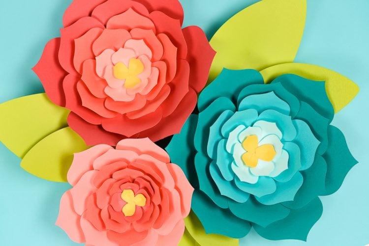 Download this giant paper flower template (hand cut or SVG for the Cricut) and then get my best tips and tricks for making them easily! Perfect for giant paper flower backdrops, beautiful home decor, and festive party decorations.