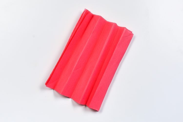 Fold the tissue paper squares, accordion style. I usually ended up with six or seven folds.