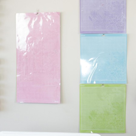Cricut mats hanging on the wall