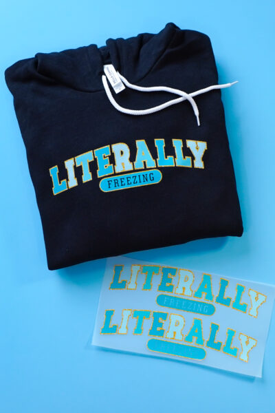 "Literally freezing" DTF transfer on hoodie with uncut gang sheet
