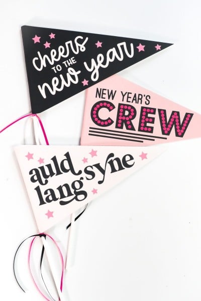 Three New Year's Eve pennants that say, Auld Lang Syne, Cheers to the New Year and New Year's Crew