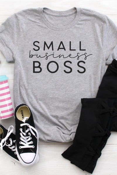 Black jeans, tennis shoes, water cup and a gray t-shirt that says, Small Business Boss