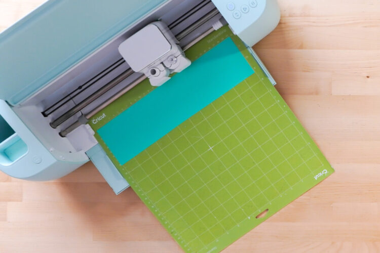 Cricut machine cutting out a stencil