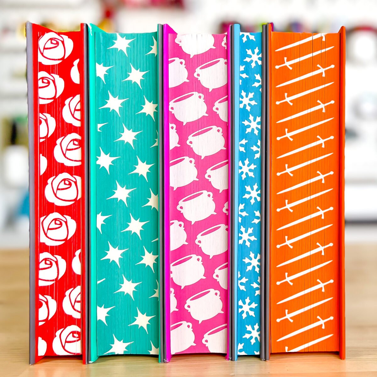 Five ACOTAR books with sprayed edges