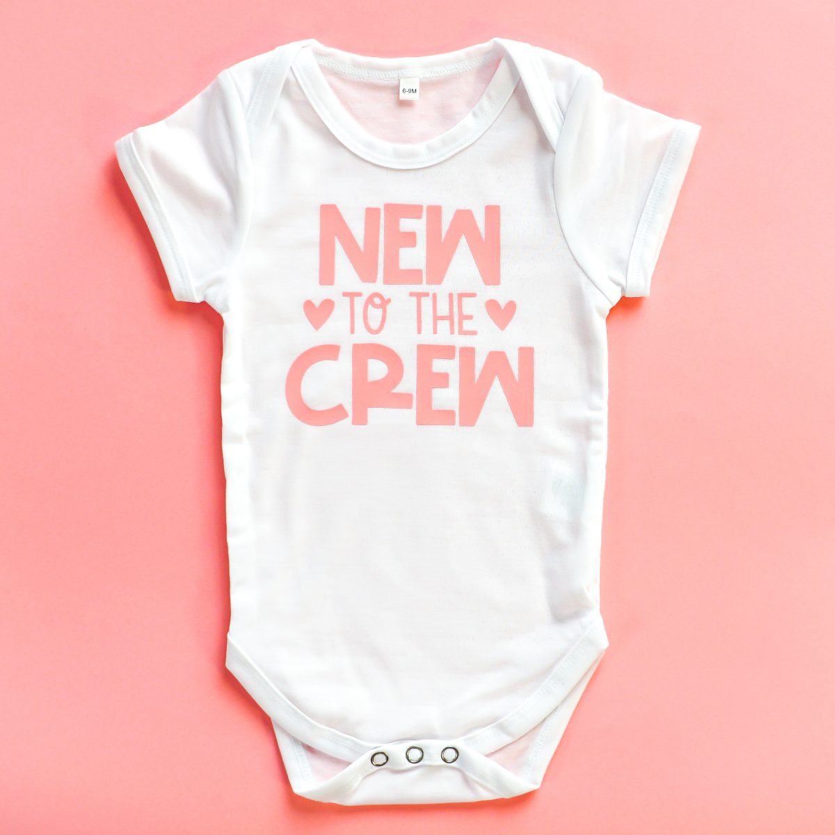 "New to the Crew" onesie using HTV.