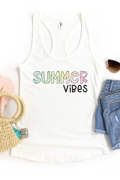 Summer Vibes white tank top with a straw purse, pink sandals, blue jeans and sunglasses