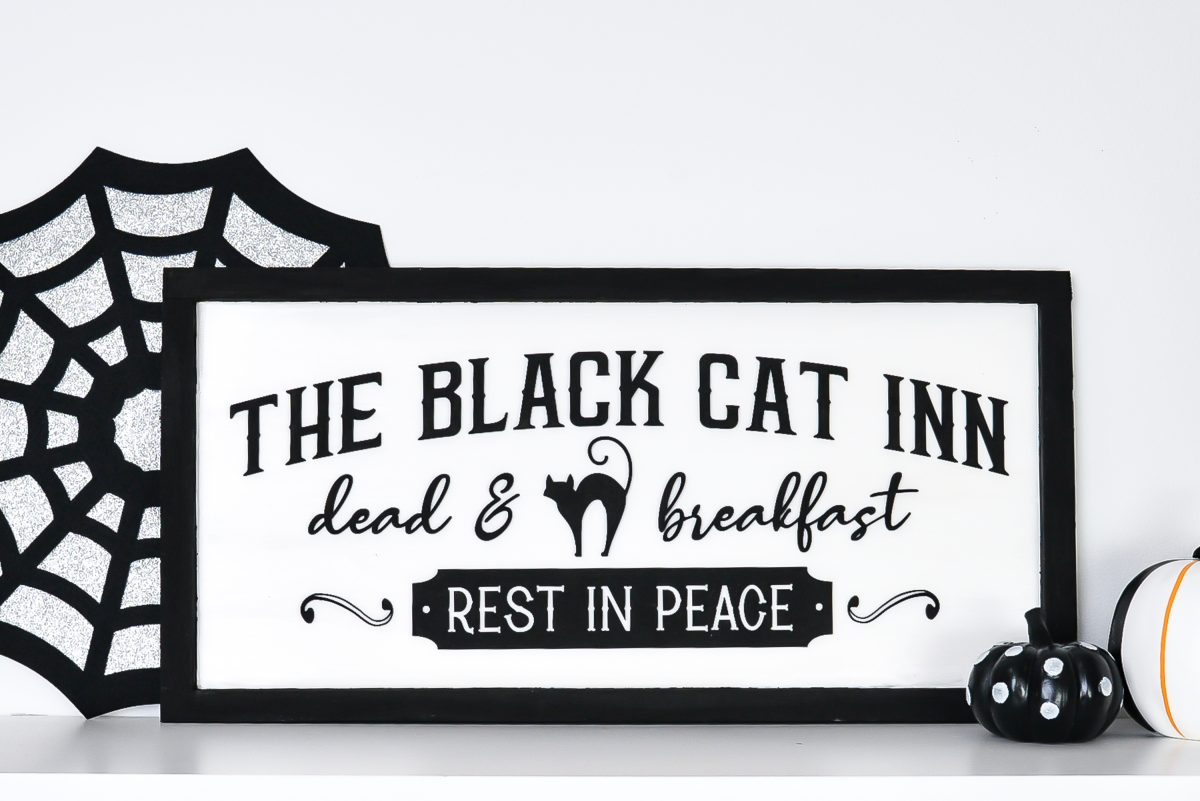 Vintage Halloween Sign: Black Cat Inn sign styled on shelf with Halloween decor