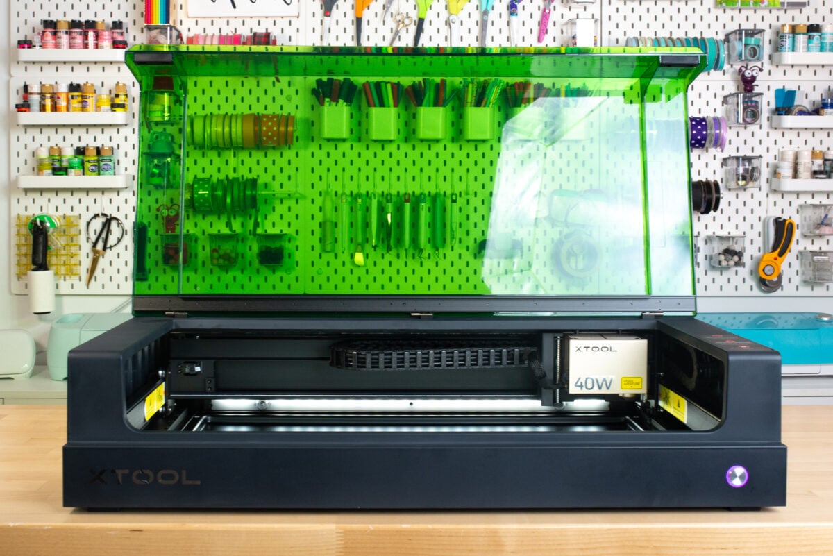 xTool S1 sitting on a table with green lid open