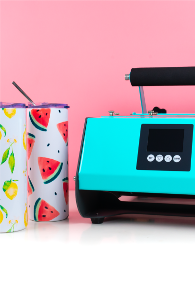 PYD Life Tumbler Press on table with tumblers and mugs and pink background